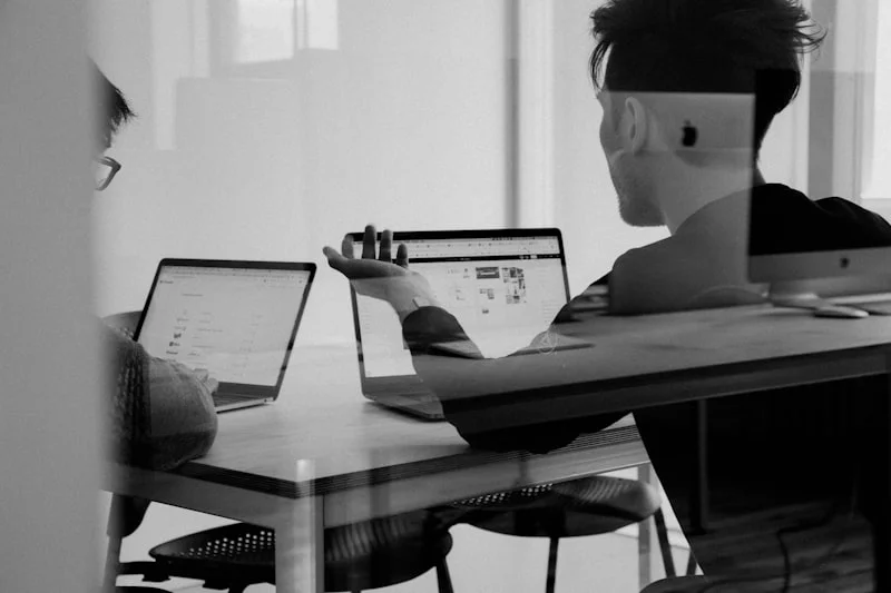 Person looking at laptop with questions, representing visitor uncertainty